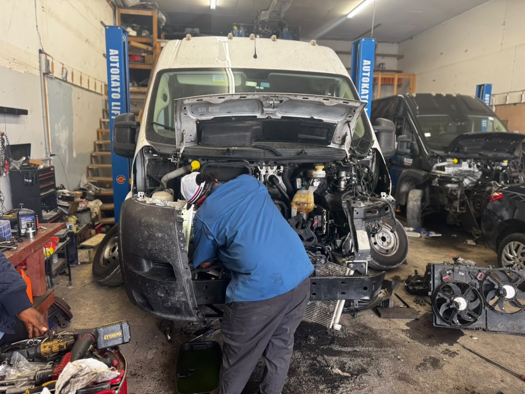 Eaglesoar technician working in the engine bay of a cargo van